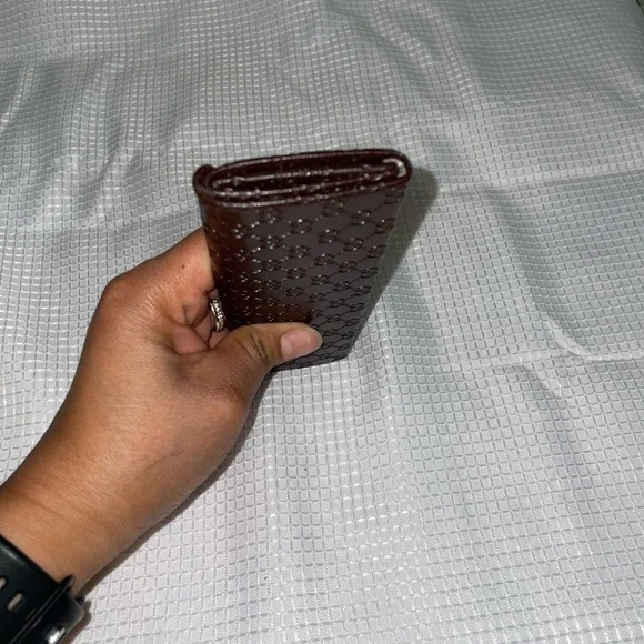 brown leather monogrammed foldable eyeglasses case from Gucci. - Picture 11 of 16